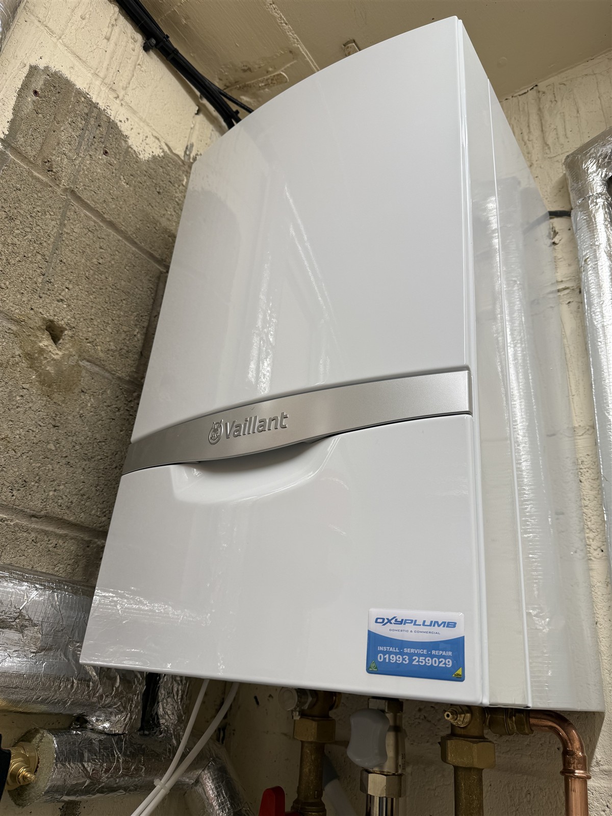 Closed Vaillant boiler casing with Oxyplumb service label at Carterton Community Hall
