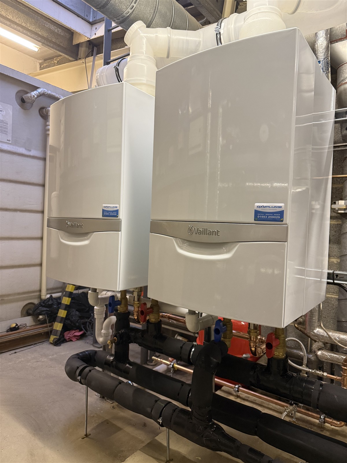 Completed twin Vaillant boiler installation with insulated flow and return pipework