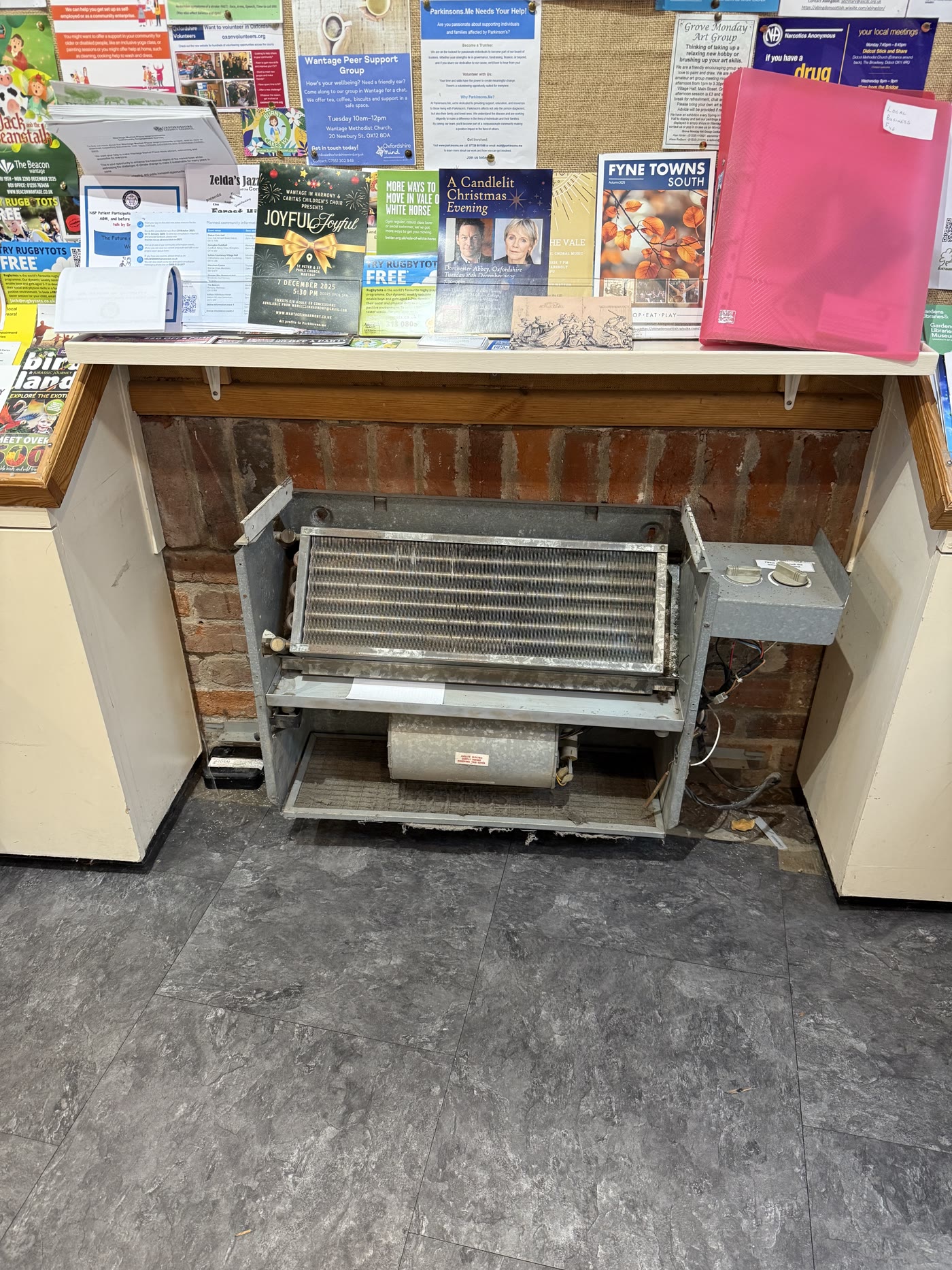 Older floor-standing room heater opened for service and inspection